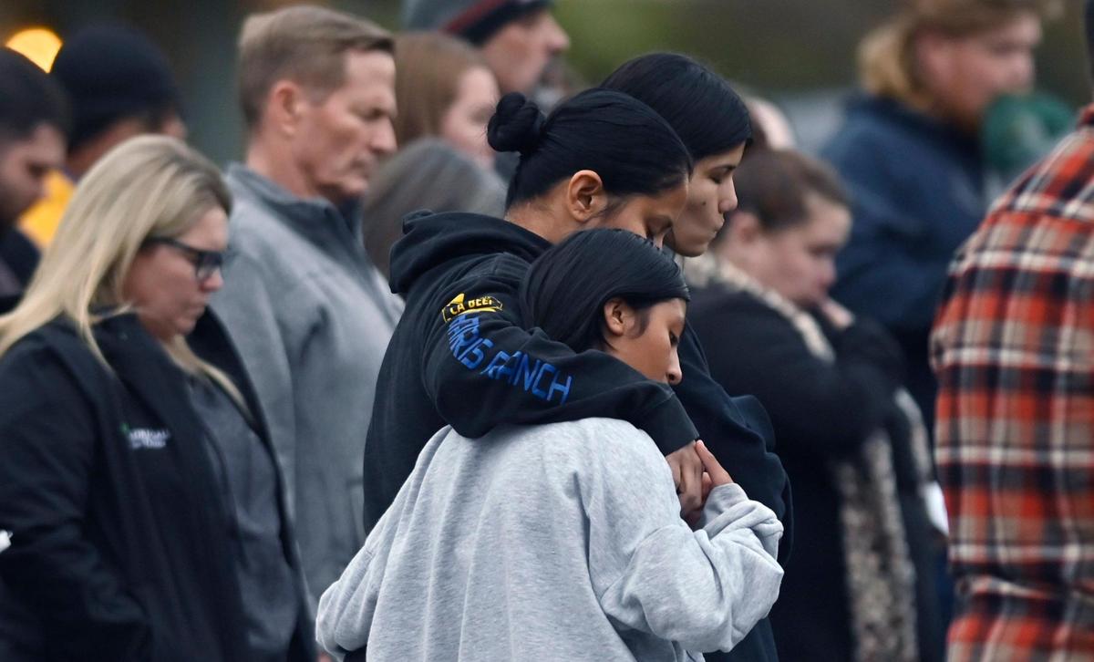Hundreds gather in front of the Bond home for a candlelight vigil for the Bond family following the murder of four family members Friday evening, Jan. 12, 2024 in Reedley.