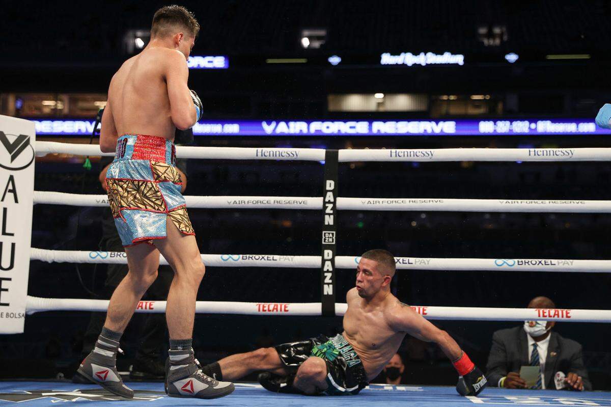 February 27, 2021; Miami, Florida; Marc Castro and John Moraga during their junior lightweight bout at the Hard Rock Stadium in Miami, FL. Mandatory Credit: Ed Mulholland/Matchroom.