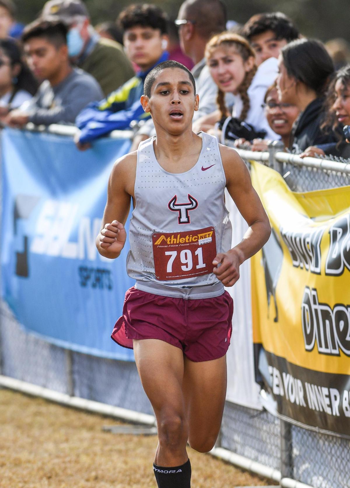 Benjamin Fernandez of Matilda Torres High finishes first in the Central Section boys Division IV cross country race at Woodward Park in Fresno on Thursday, Nov. 17, 2022.