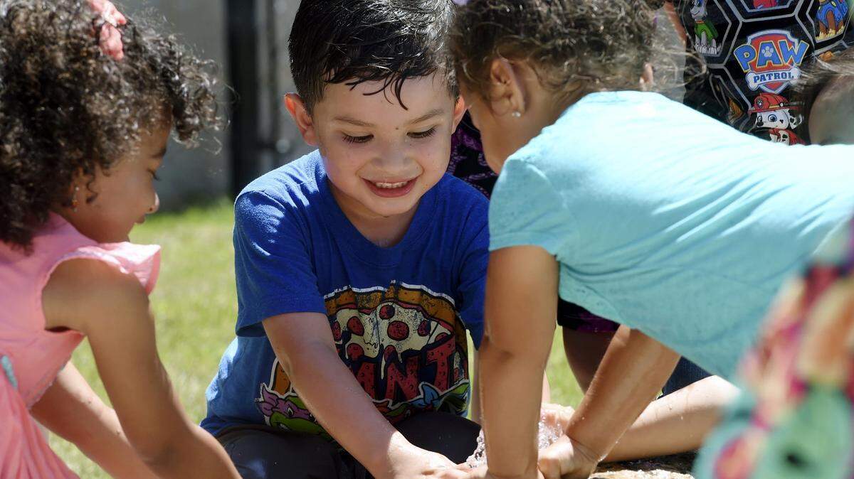 Dominick Perez, center, plays with other children at an open house for Lighthouse for Children Child Development Center, created by First 5 Fresno County and operated by Fresno County Office of Education, in this 2016 photo.
