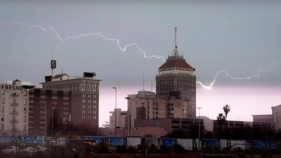 Lightning rips across the sky above Fresno’s skyline, during Wednesday’s storm, March 10, 2021, in a frame grab from video.