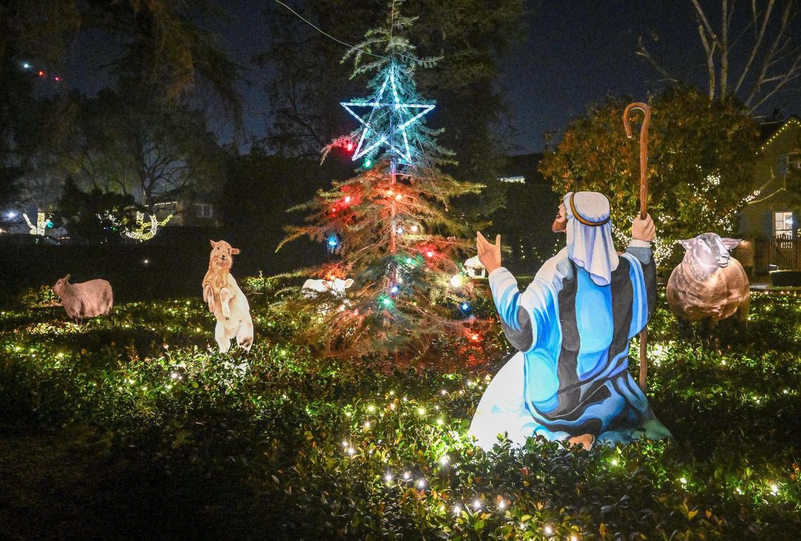One of many custom-decorated homes greets holiday revelers on Christmas Tree Lane in Fresno on the first of two walk-only nights on Tuesday, Dec. 3, 2024.