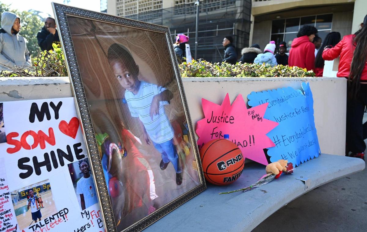 A framed photo of a younger Rashad Al-Hakim Jr. is shown as family and supporters gather at a rally demanding justice for the 15-year old Hoover High School student killed in a hit and run Oct. 4, 2022 outside the Fresno County Courthouse Monday morning, Jan. 23, 2023 in Fresno. The accused driver, Lisa Ellen Spoors, received reduced bail and left jail January 19.