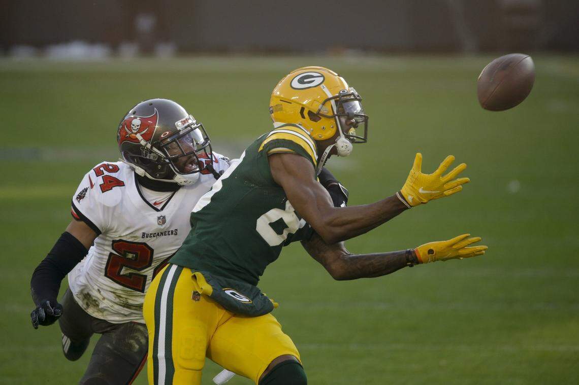 Green Bay Packers wide receiver Marquez Valdes-Scantling makes a 50-yard touchdown catch against Tampa Bay’s Carlton Davis during the first half of the NFC championship Sunday, Jan. 24, 2021.