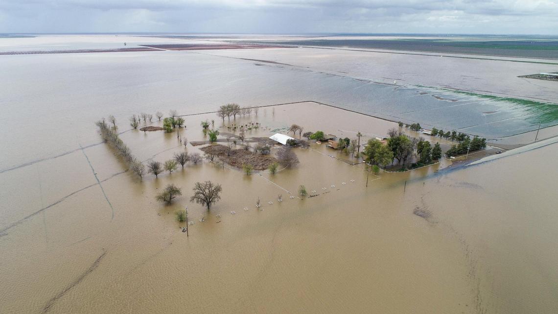 A farming ranch is surrounded by floodwater in the old Tulare Lake basin area of Kings County south of Corcoran on Thursday, March 23, 2023.