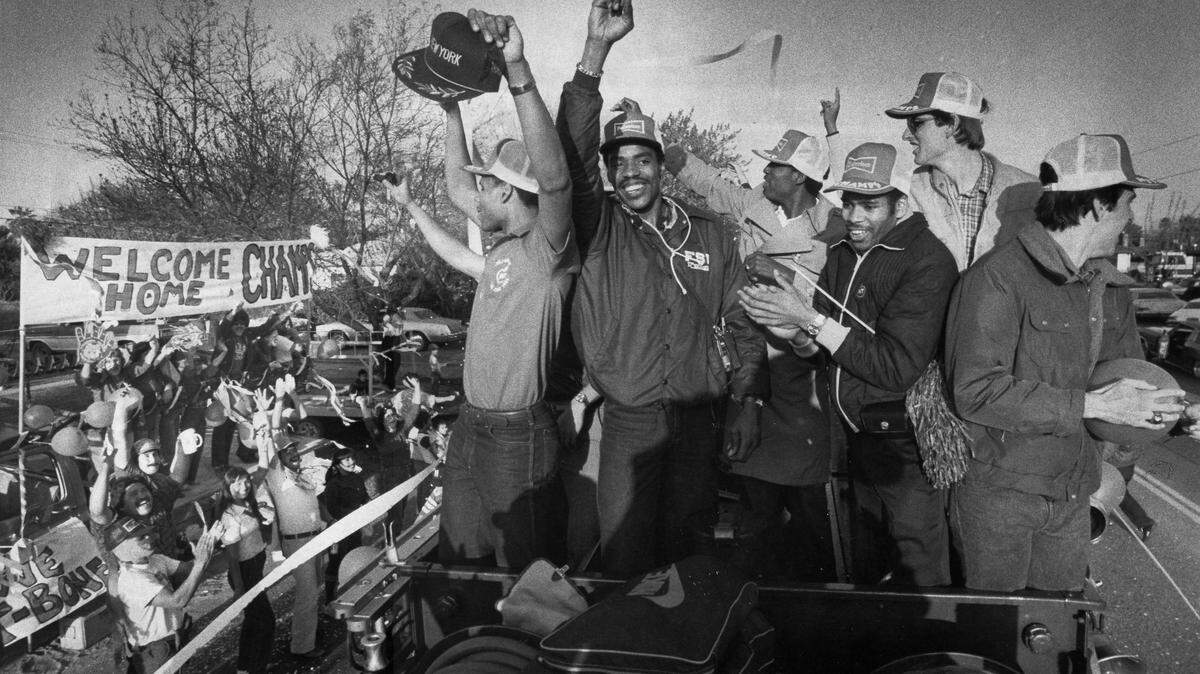 Fresno State basketball players are celebrated in a parade after winning the National Invitation Tournament championship in 1983.