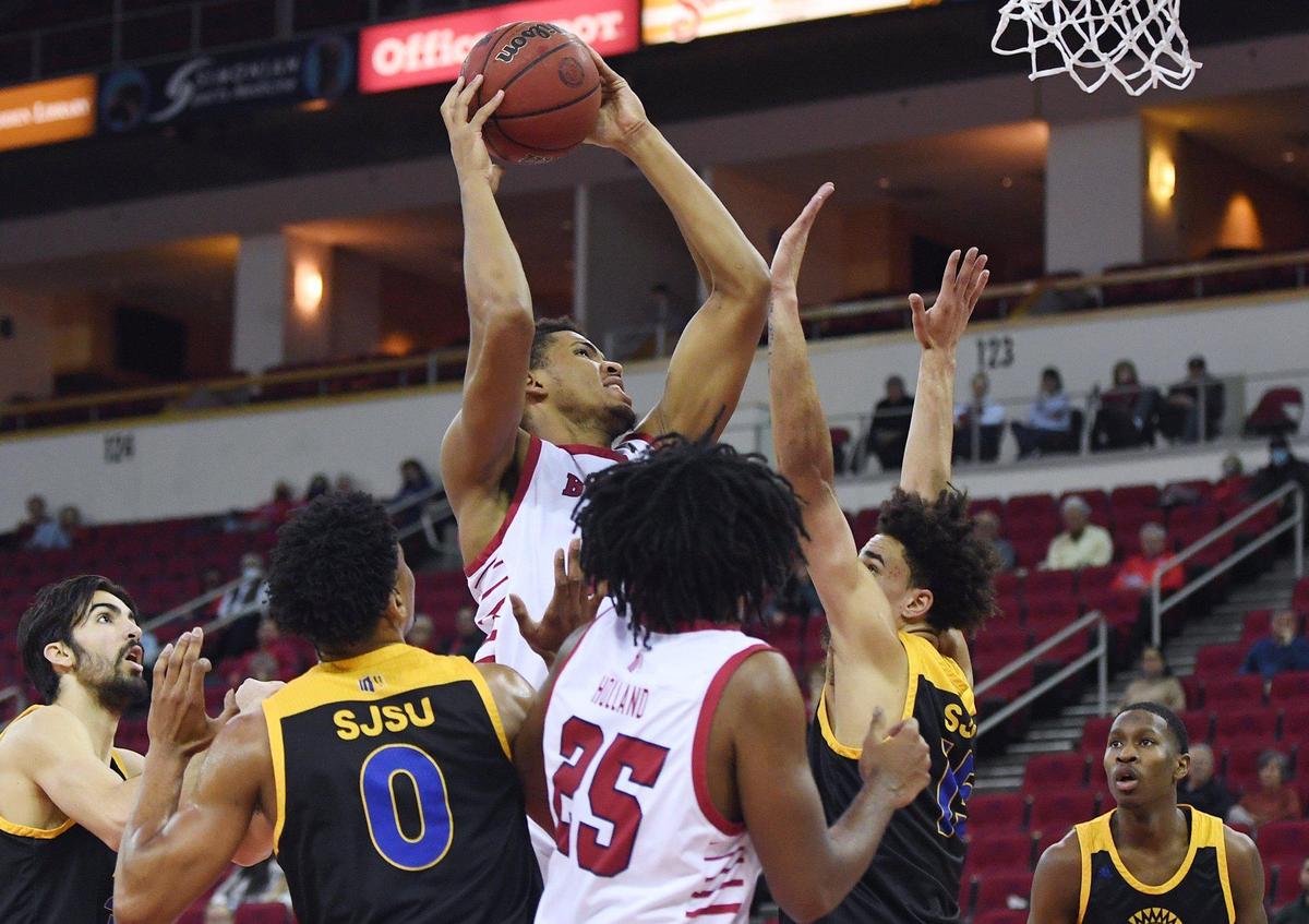 Fresno State’s Orlando Robinson, top center,, usrrounded by San Jose State’s defense Tuesday night, Jan. 11, 2022 in Fresno. The Bulldogs led the Spartans 39-28 at halftime.