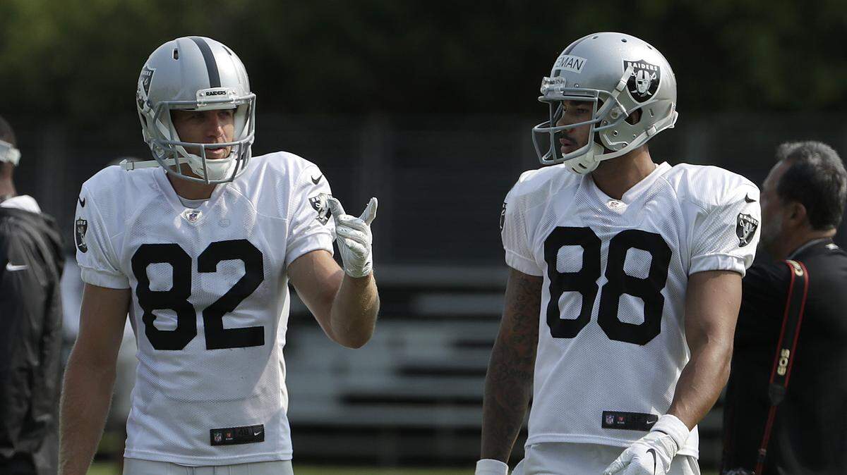 Oakland Raiders’ Jordy Nelson (82) talks with Marcell Ateman (88) during NFL football practice in Napa, Calif., Wednesday, Aug. 1, 2018. Ateman was promoted to the active roster after the trade of Amari Cooper to the Dallas Cowboys this week.