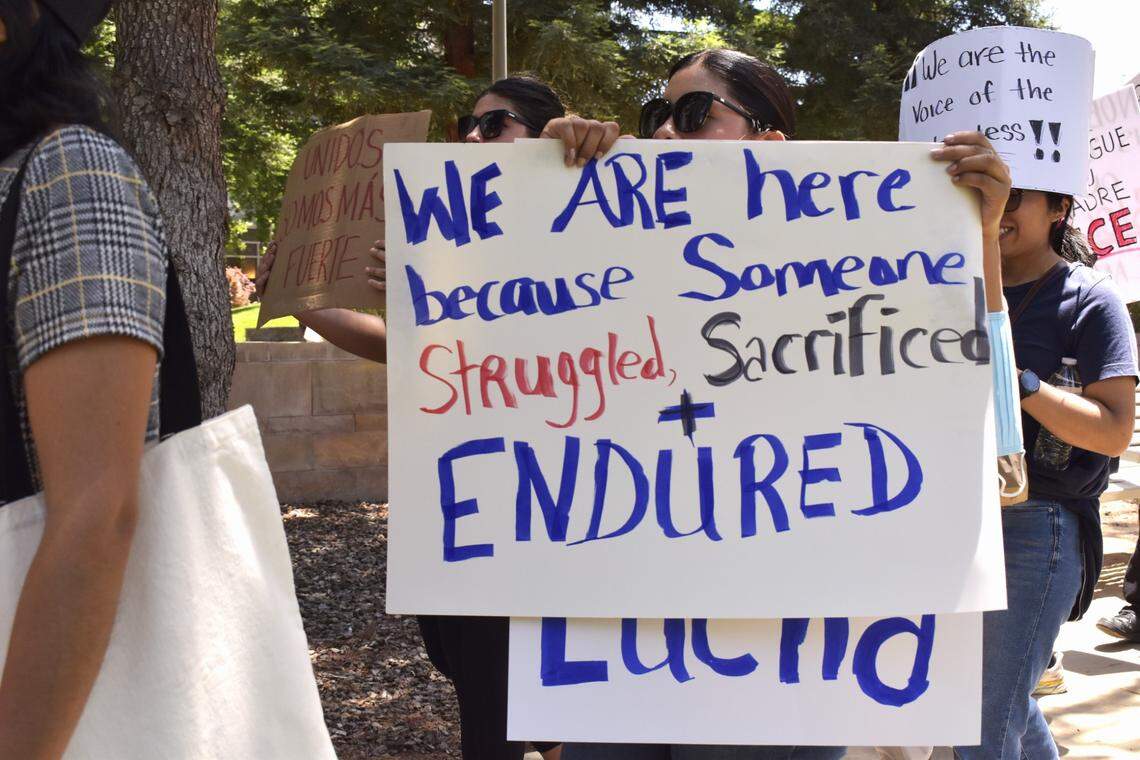 Protestors advocating for immigrants’ rights march with signs outside the Robert E. Coyle federal courthouse in downtown Fresno on Monday, June 9, 2025.