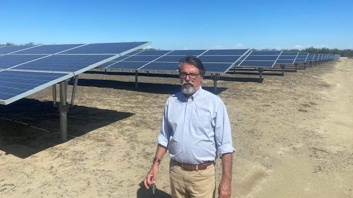 Stuart Woolf, president and CEO of Woolf Farming, stands next to land the company leases for solar-power generation. The farm is near Huron on Fresno County’s west side.