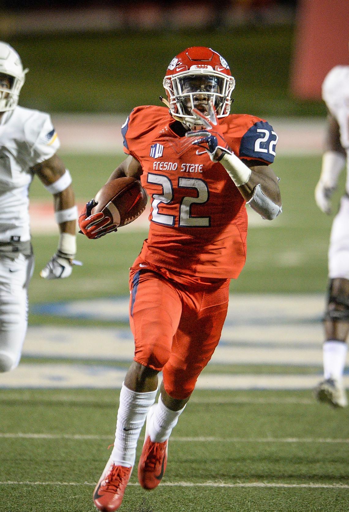 Fresno State running Jordan Mims races down field on a 55-yard pass from Marcus McMaryion in a 49-27 victory over the Toledo Rockets at Bulldog Stadium on Saturday, Sept. 29, 2018. Mims caught six passes for 126 yards and one touchdown and added 59 rushing yards and one touchdown on 15 plays.