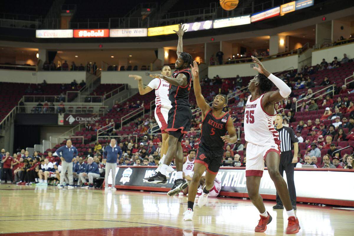 Fresno State center Eduardo Andre beats San Diego State’s Lamont Butler to the basket off a pick and roll pass from point guard Isaiah Hill in the Bulldogs’ 45-43 loss at the Save Mart Center, Wednesday, Feb. 15, 2023.