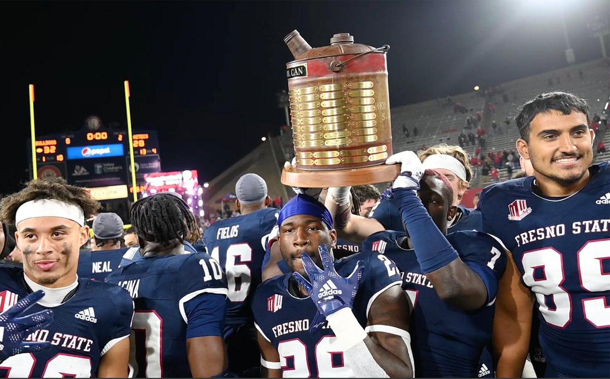 The Fresno State football tea celebrates its 32-28 win over San Diego State, pulling ahead in the final minutes to win the Battle For The Old Oil Can Saturday, Oct. 29, 2022 in Fresno.
