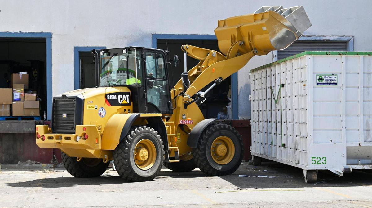 Office cases are dumped as the cleanup process continues at the closed warehouse location which had been illegally operated by Chinese company Prestige Biotech, seen Tuesday, August 1, 2023 in Reedley.