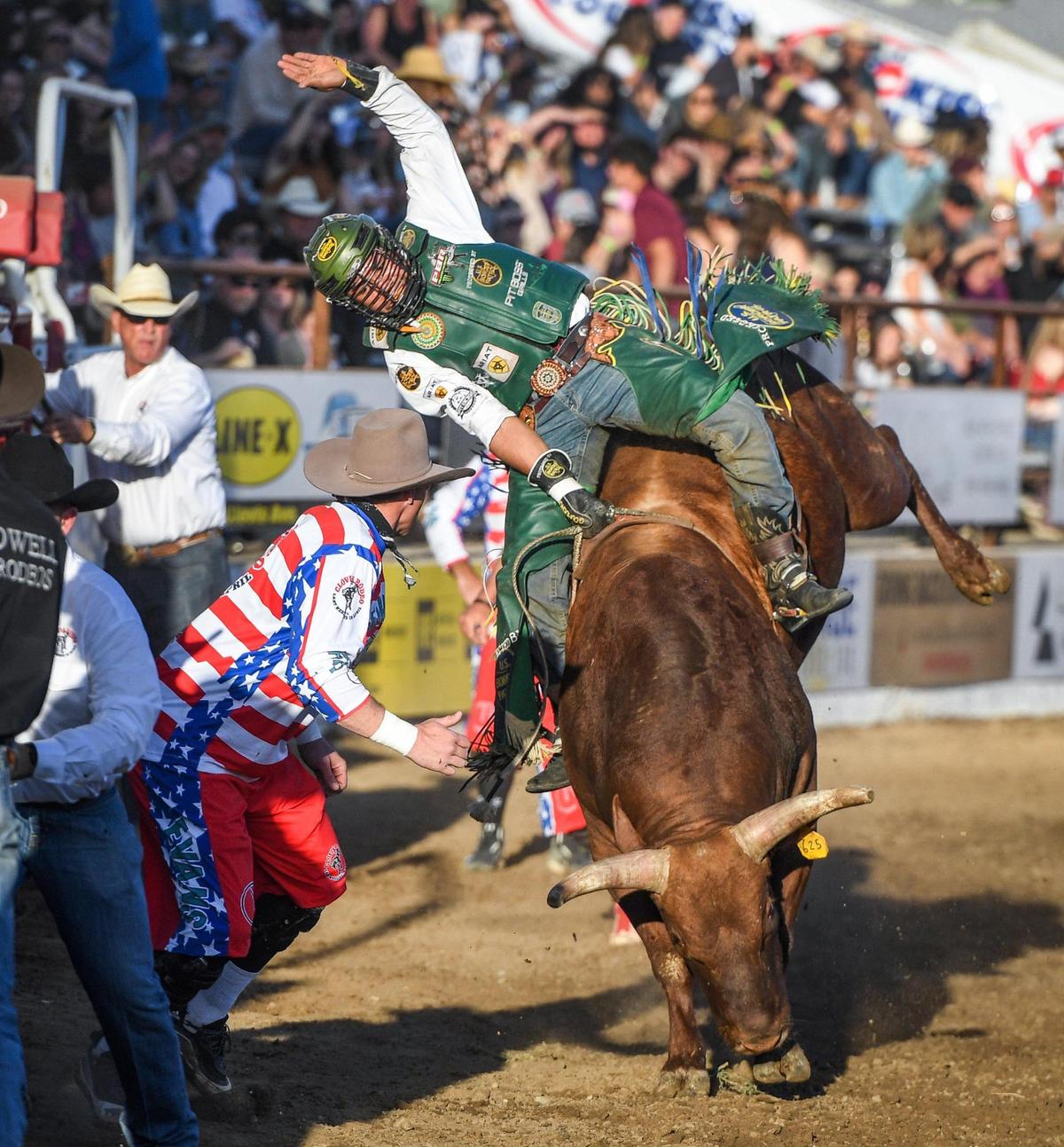 Keyshawn Whitehorse rides Red Hawk in the first section of bull riding during the Professional Bull Riders event on the opening day of the Clovis Rodeo on Wednesday, April 20, 2022.