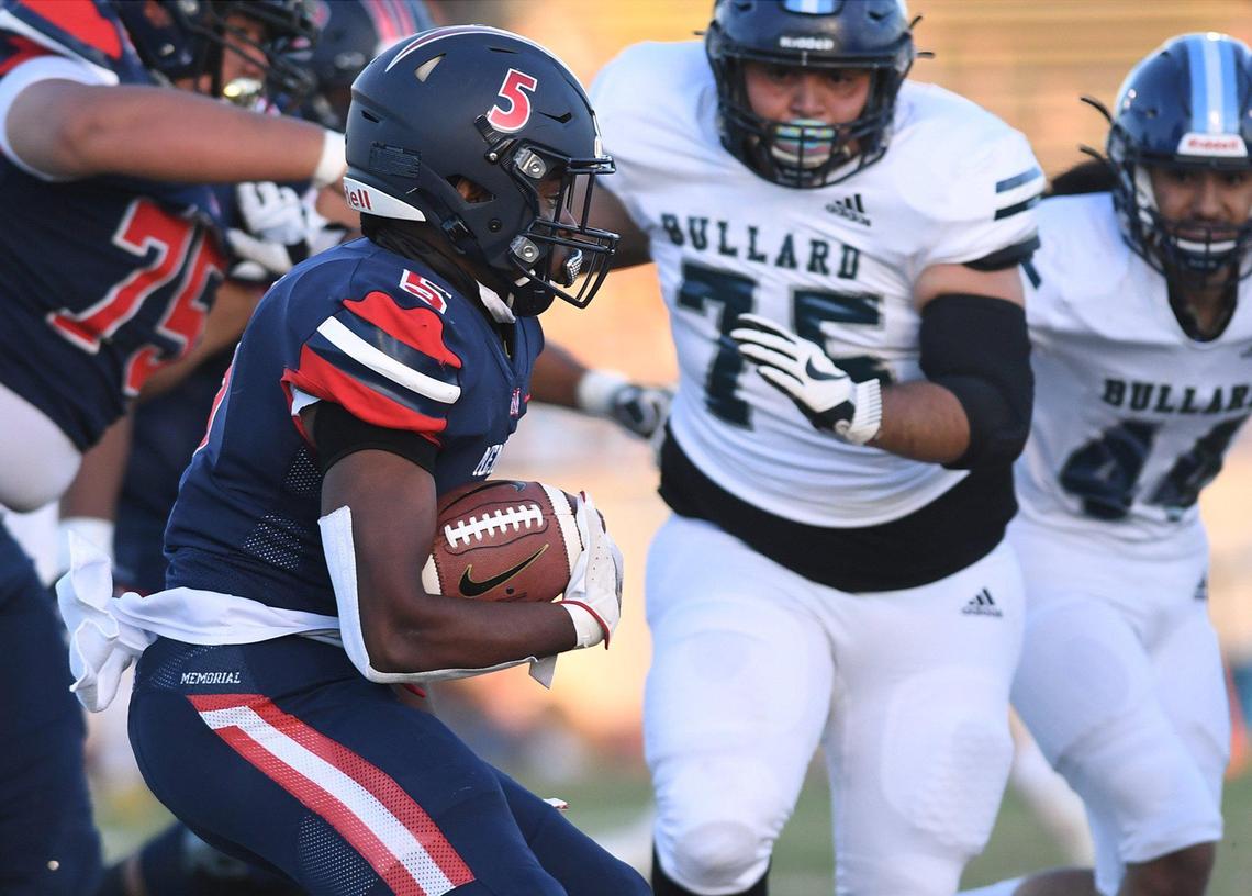 San Joaquin Memorial’s Jordan Hornbeak carries the ball against Bullard High on Friday, April 9, 2021 in Fresno. The Panthers won 29-2.