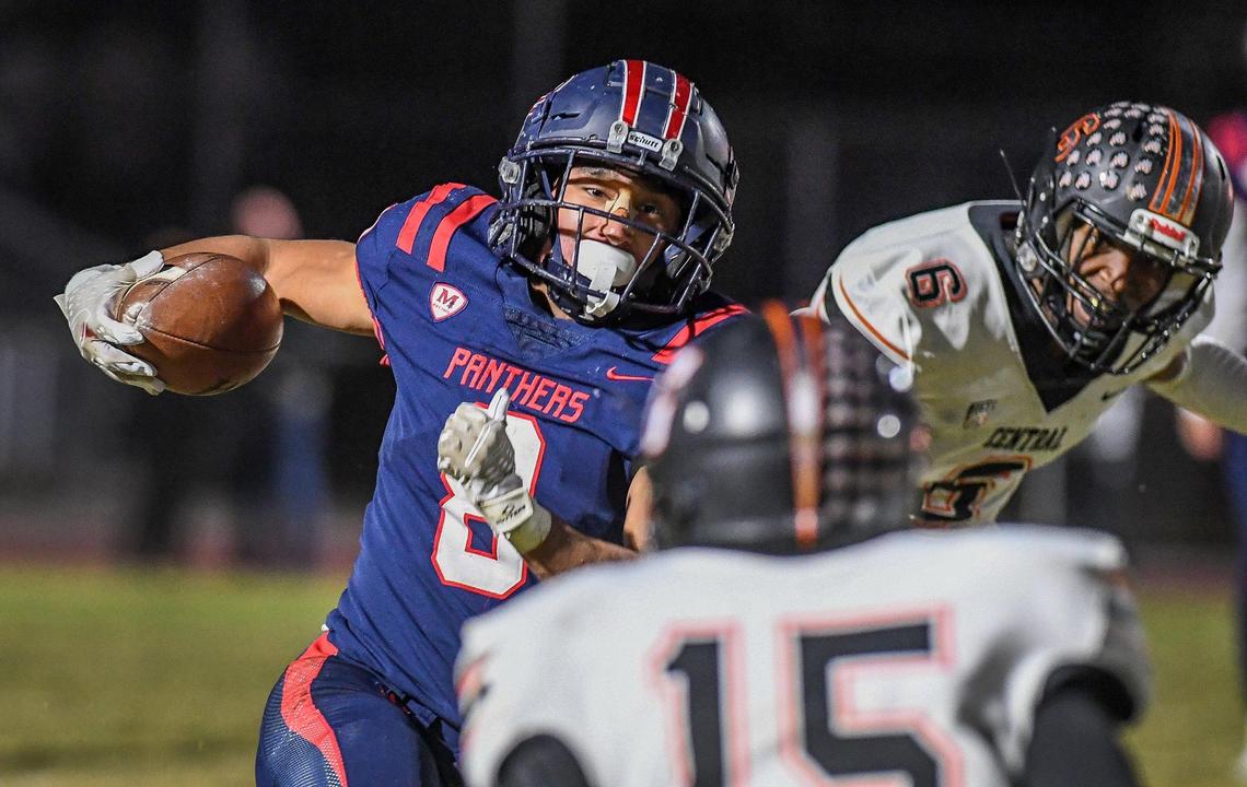 Memorial’s Brandon Ramirez tries to find a hole in the Central defense on a run in their Division I playoff game at San Joaquin Memorial on Thursday, Nov. 10, 2022.