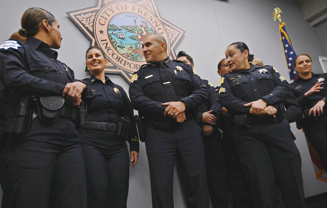 Fresno Police Deputy Chief Mindy Casto, second from left, stands next to Police Chief Paco Balderrama, center, at a news conference announcing the department’s 30x30 Pledge, a commitment to improve the representation of women in the police force on Friday, March 25, 2022 in Fresno.