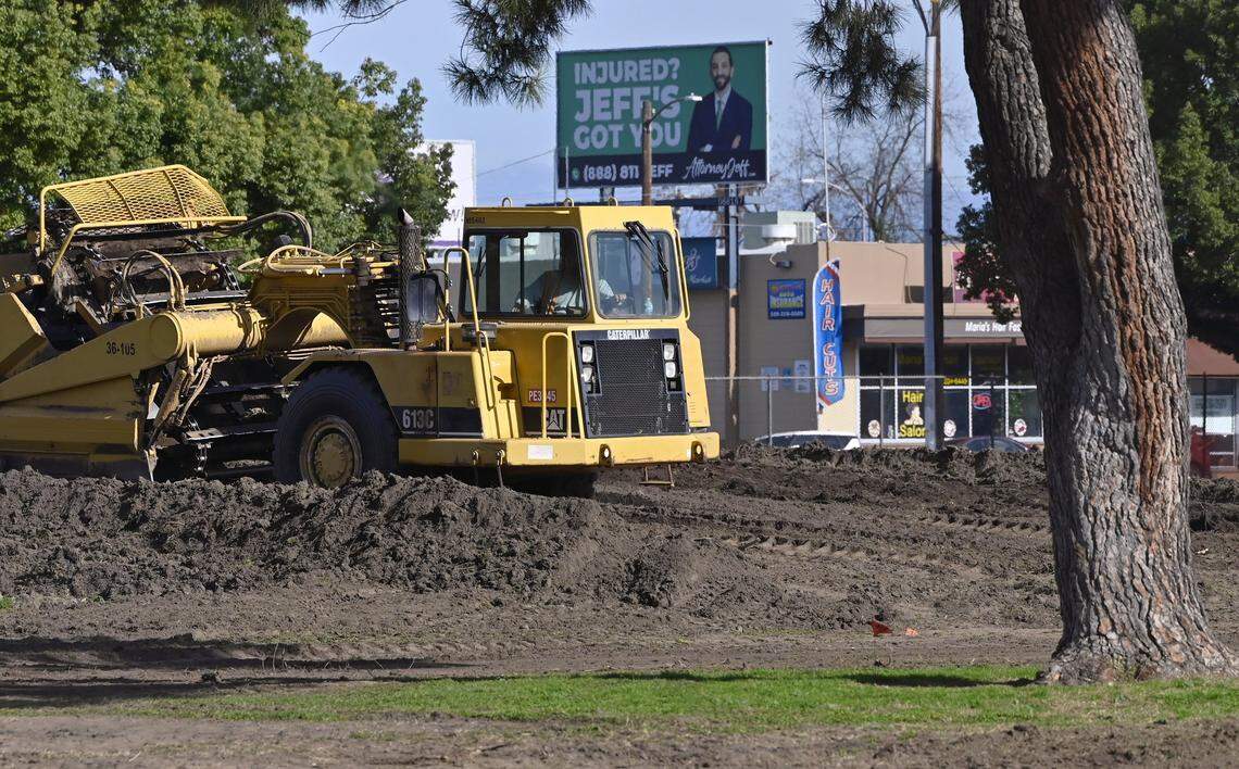 Heavy machinery scrapes dirt at Radio Park, which is closed to the public as renovations continue through early 2027, on Monday, Dec. 22, 2025 in Fresno.