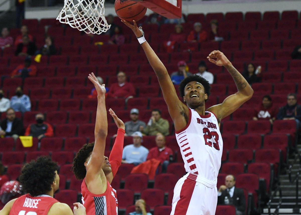 Fresno State’s Leo Colimerio, right, with New Mexico’s Javonté Johnson, center, and Jaelen House, left, Monday, Feb. 28, 2022 in Fresno. Fresno State led 39-31 at the half.