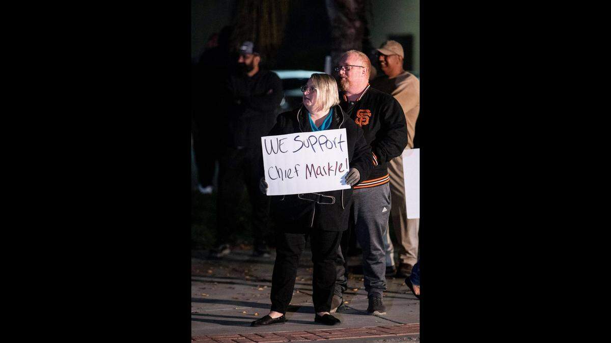 Theresa Land, 52, of Livingston, joins fellow residents in a call to action rally while demanding answers from elected officials outside Livingston City Hall in Livingston, Calif., on Thursday, Nov. 18, 2021. Livingston Police Chief John Markle, was recently placed on administrative leave by Interim City Manager Vanessa Portillo.