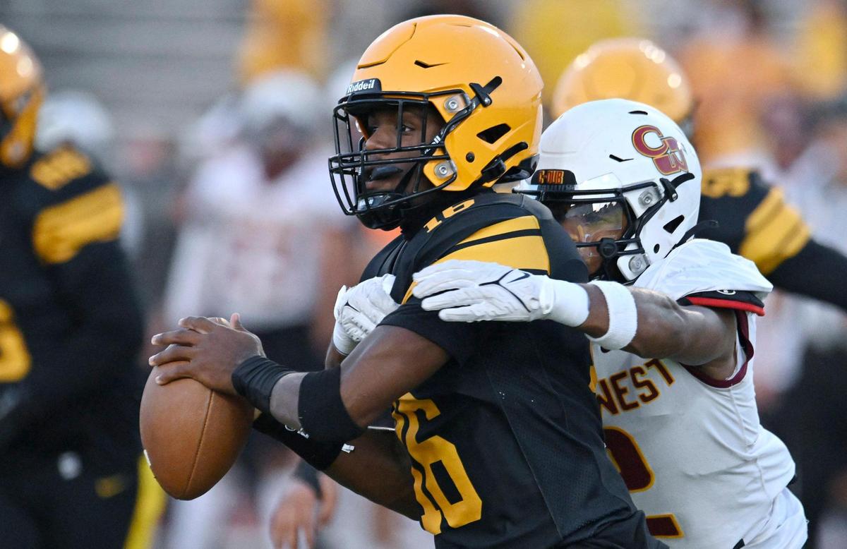 Clovis West’s Jordan Pierro, background, closes in on Edison quarterback Phoenix Lawrence for the sack Friday, Sept. 15, 2023 in Fresno.