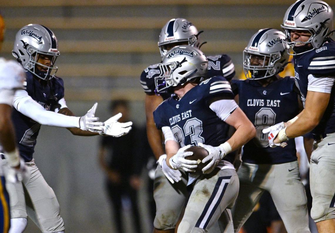 Clovis East celebrates Jax Koontz’s interception, center, against Grant Union Friday, Sept. 13, 2024 in Clovis.