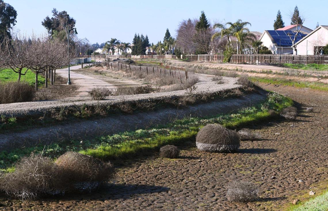 The Enterprise Canal Trail is seen to the left, running along the Enterprise Canal north of SR 168 Thursday, Jan. 26, 2023. The City of Clovis is planning a bridge crossing over SR 168 near Clovis Community Medical Center linking the Enterprise Canal Trail on both sides for cyclists and pedestrians. Still in the planning stages, three designs were shown at a public workshop on January 25.