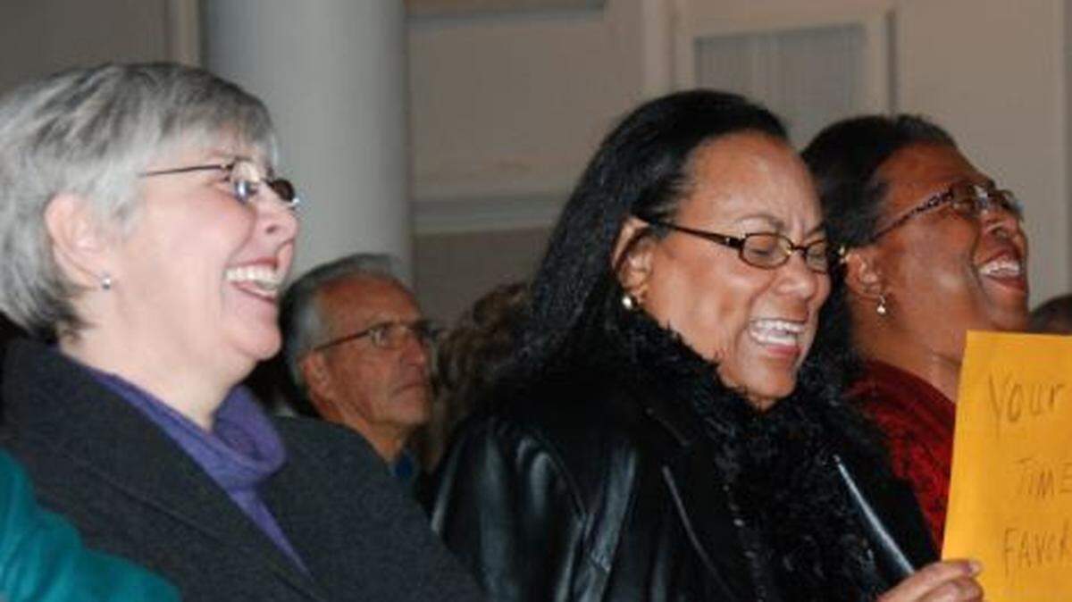 Leslie Villalt, left, shares a good laugh with Phillis Taylor, right, and Deborah Lewis, center, during a Nat King Cole tribute at The Falasco Arts Center.