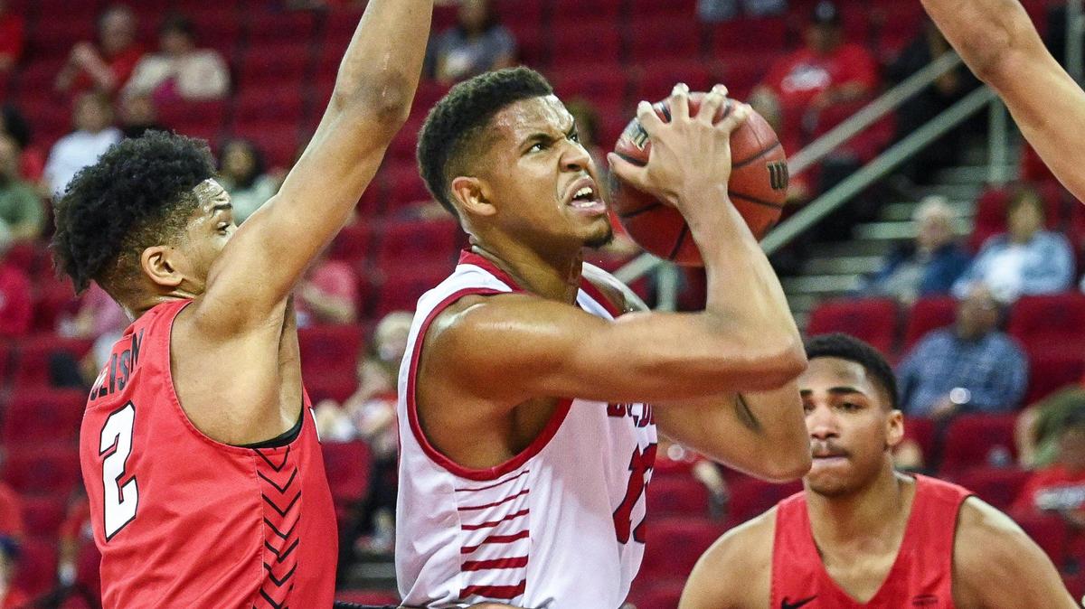 Fresno State’s Orlando Robinson, center, tries to find an opening to the hoop against Youngstown during their quarterfinal game in the 2022 Basketball Classic tournament at the Save Mart Center in Fresno on Wednesday, March 23, 2022.