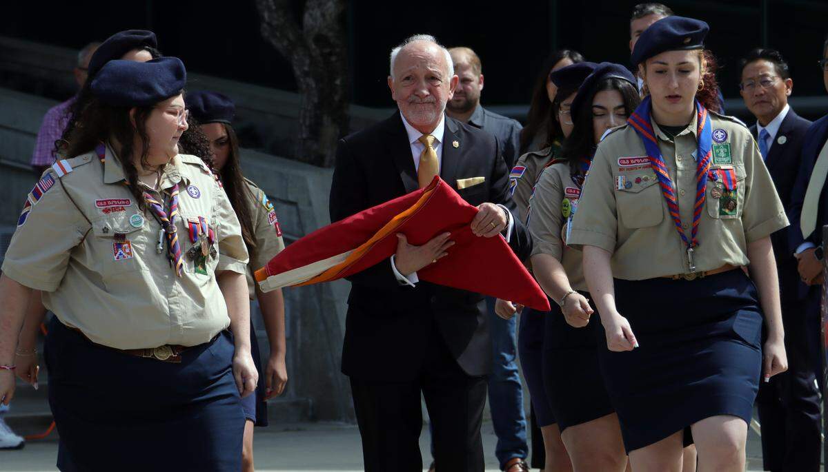 Fresno’s Honorary Consul to Armenia Berj K. Apkarian carries the country’s flag at the annual Armenian genocide commemoration and flag-raising ceremony at Fresno City Hall on April 24, 2025.