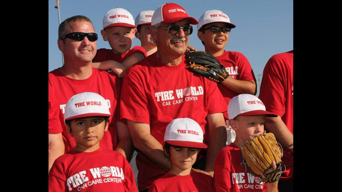 In May 2013, Dave Nannini poses with one of the many teams he helped coach in the Merced Youth Baseball organization for over 40 years.