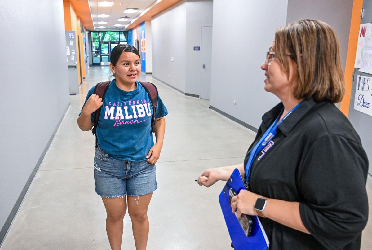Duncan Polytechnic High School senior Taylor Cruz is congratulated by a teacher after passing her CNA program exam prior to graduation on Wednesday, May 22, 2024.