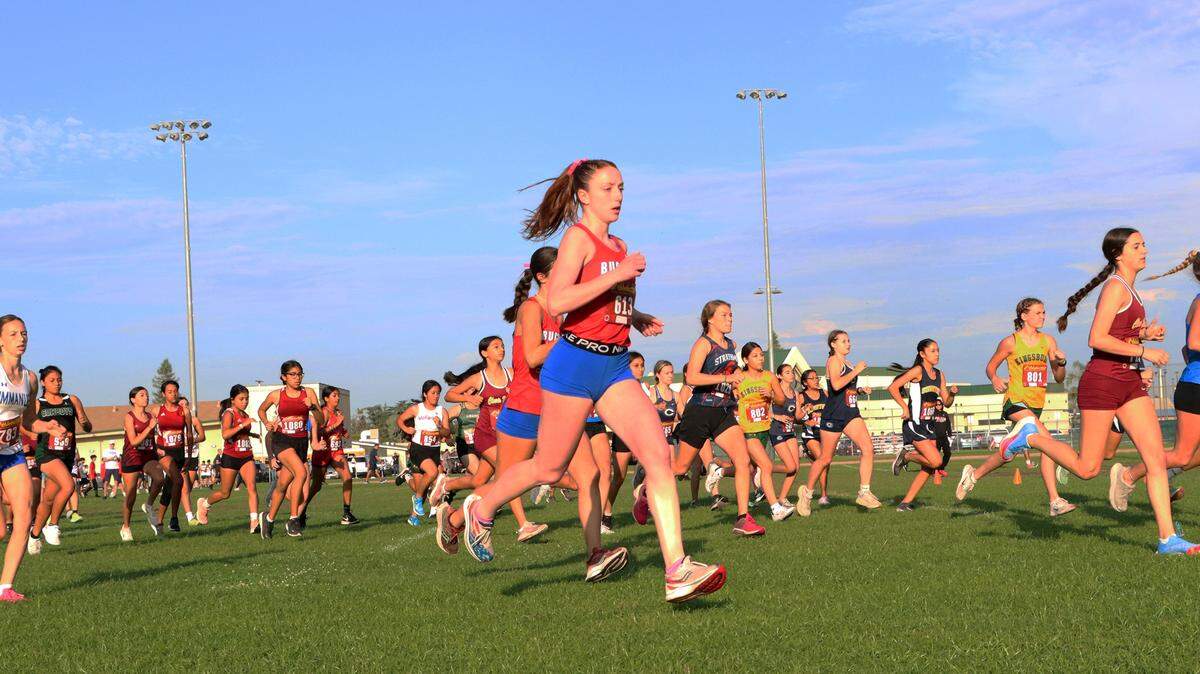 Buchanan High freshman Kendall Metzler (No. 613) competes in the freshman girls race of the Kingsburg 2 Mile cross country meet at Kingsburg High on Sept. 9, 2023.