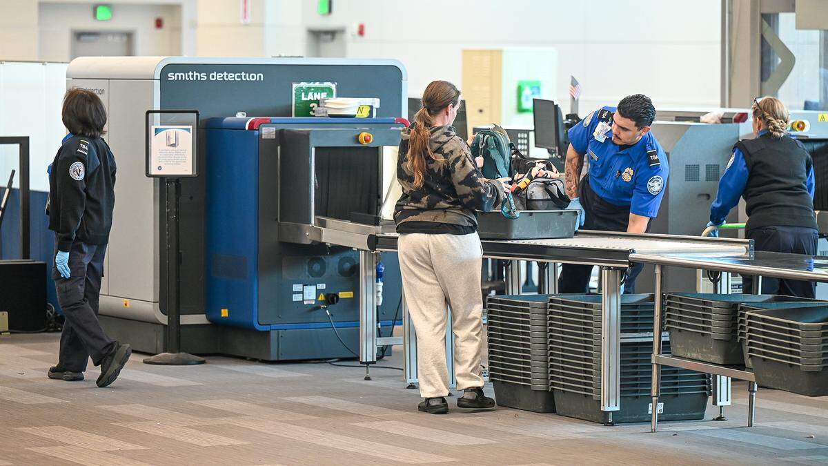TSA agents work the security station at Fresno Yosemite International Airport on Tuesday afternoon, March 10, 2026.