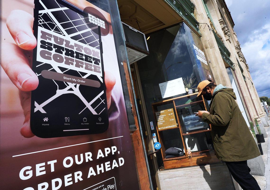 Gilbert Felix stands waiting for his order at Fulton Street Coffee in downtown Fresno in this 2021 Fresno Bee file photo. Fulton Street Coffee won a poll asking Fresno Bee readers who made their favorite cup of coffee.