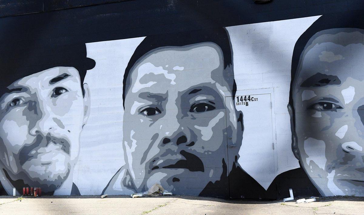 A new addition to the mural at 1444 C Street by Omar ‘Super’ Huerta, is the portrait of street vendor Lorenzo Perez, center, who was murdered on March 21, 2021.
