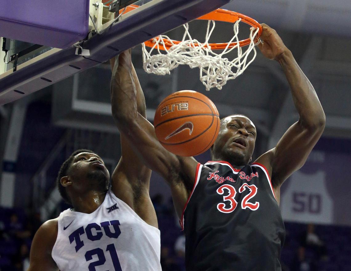 Fresno State forward Nate Grimes dunks the eball over TCU center Kevin Samuel (21) in the second half of the Bulldogs’ 77-69 loss to the Horned Frogs Thursday, Nov. 15, 2018, in Fort Worth, Texas. Grimes had eight points and six rebounds for the Bulldogs.