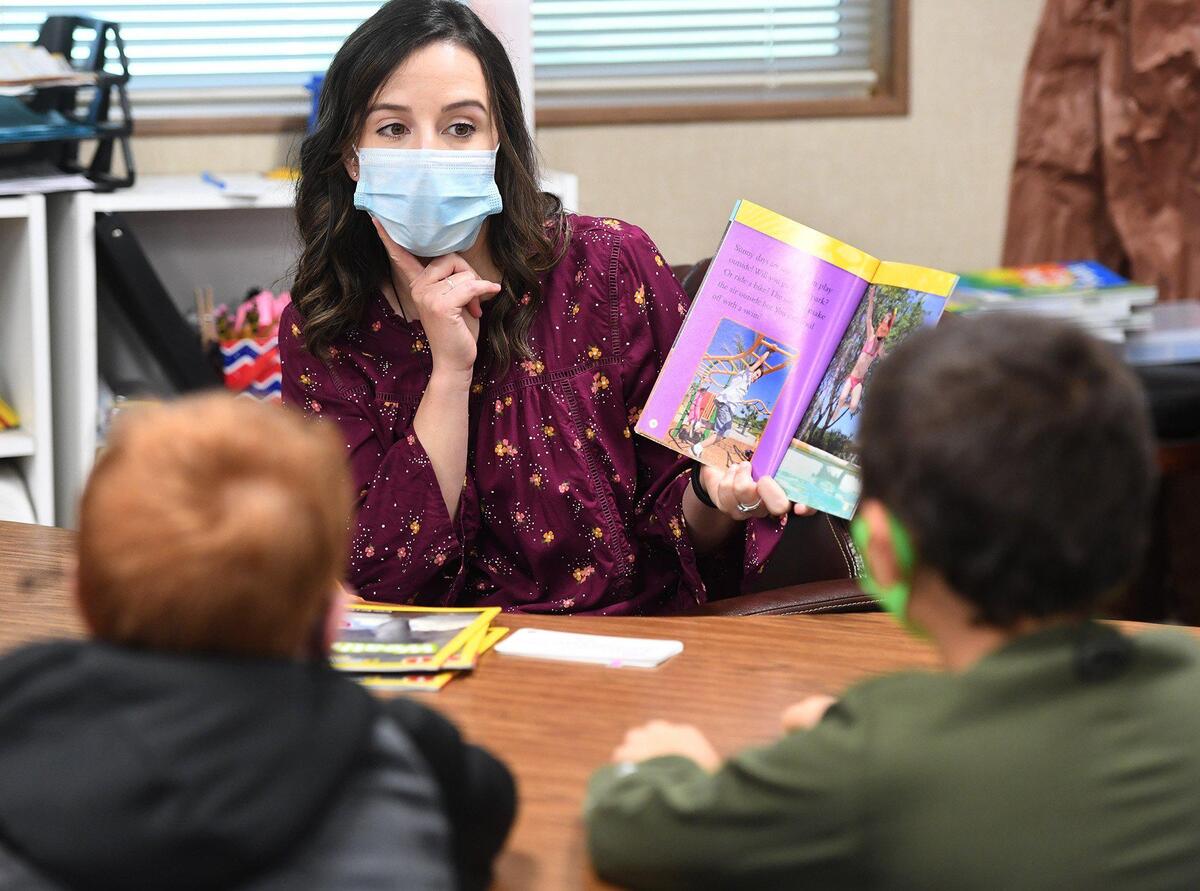 Lincoln School second grade teacher Kelsi Iturralde works with her guided reading group of students Wednesday Oct. 20, 2021.