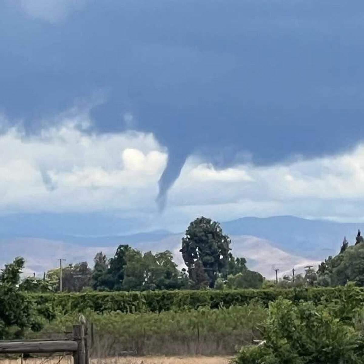 A funnel cloud is seen near Sanger, California, on Thursday, May 4, 2023.