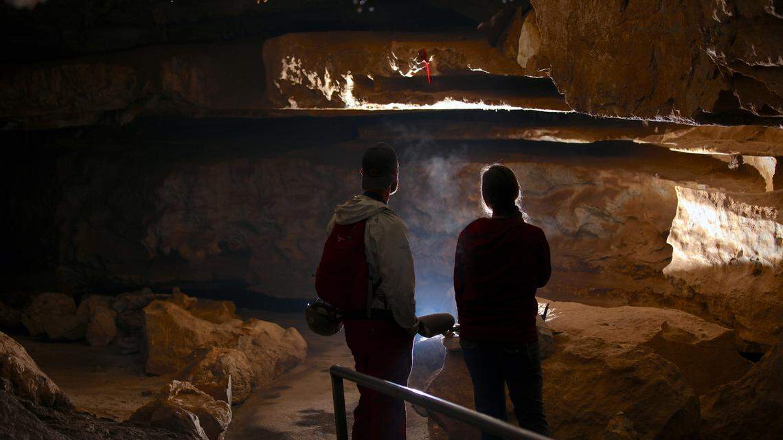 Two people admiring Crystal Cave within Sequoia National Park.