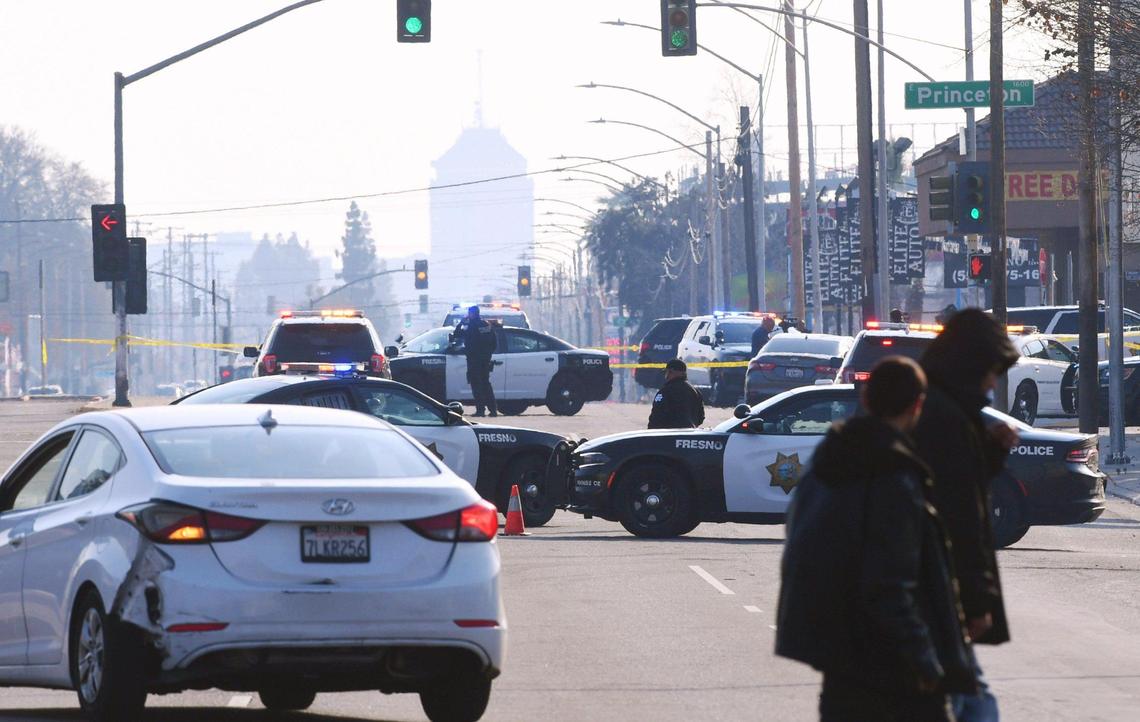 Southbound Blackstone Avenue is closed to traffic as police investigate a double homicide at a strip mall located at Blackstone and Princeton avenues on Wednesday, Dec. 14, 2022 in Fresno.