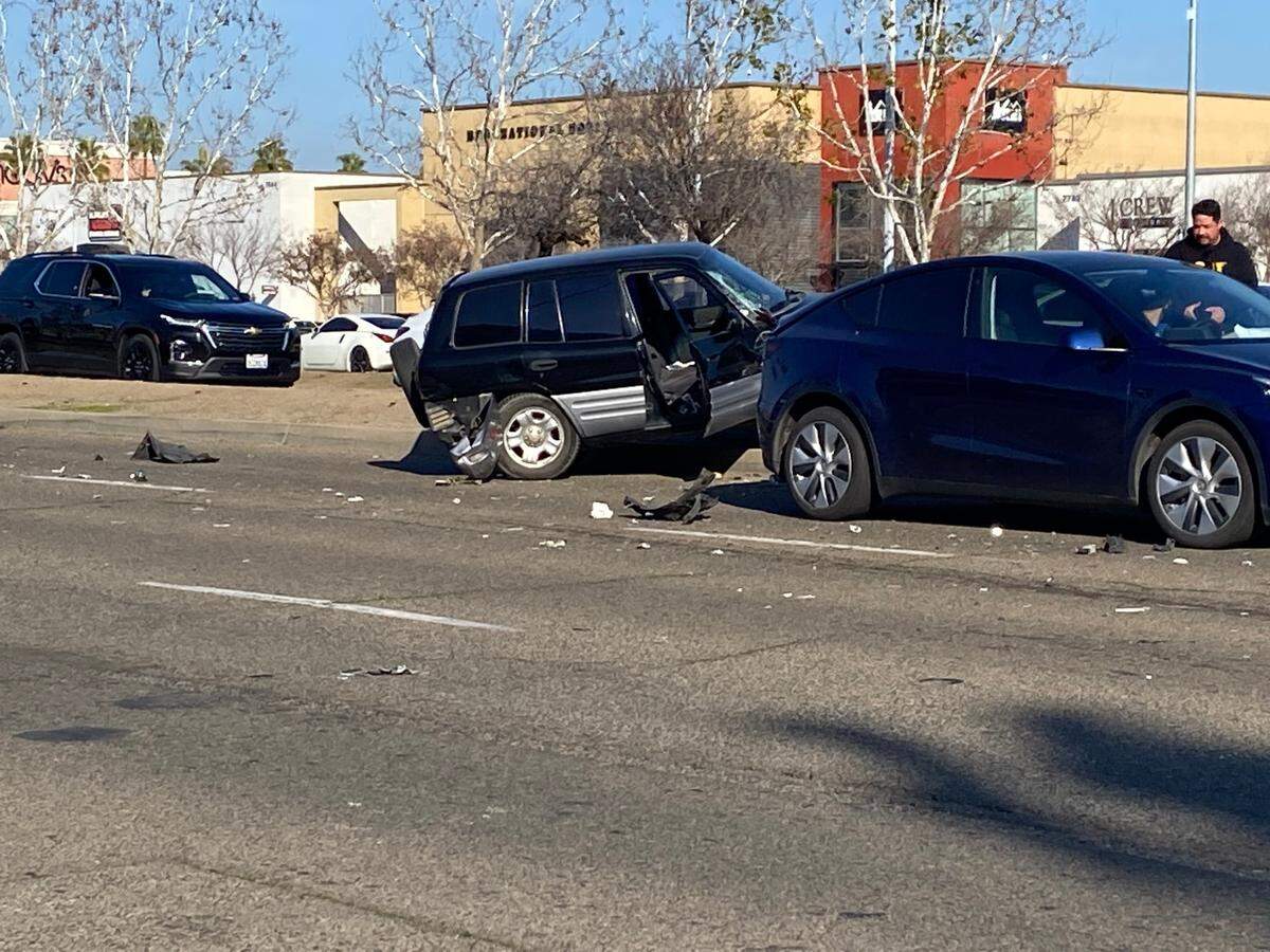 A vehicle ends up on the median following a crash near a demonstration on Sunday, Jan. 12, 2025.