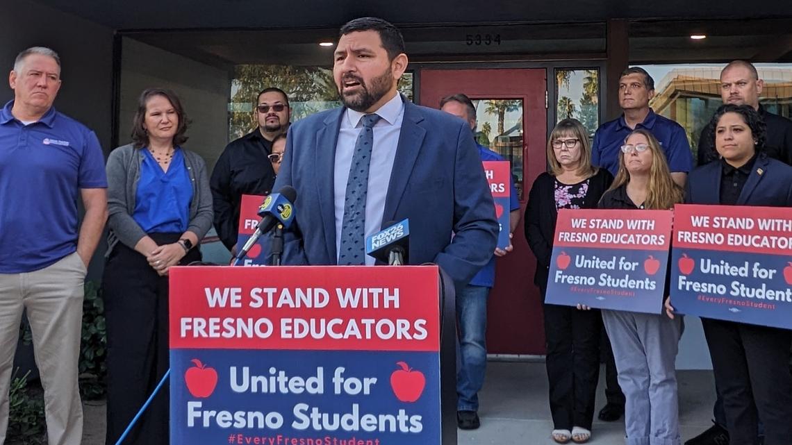 Fresno Teachers Association president Manuel Bonilla (center) publicly announced the union voted in favor of striking on Tuesday morning, Oct. 24, 2023 at the FTA’s offices in Fresno. The vote in favor allowed the FTA executive board (standing behind Bonilla) to decide Nov. 1 will be the start of educators’ picket lines if they and Fresno Unified School District don’t come to an agreement before then.