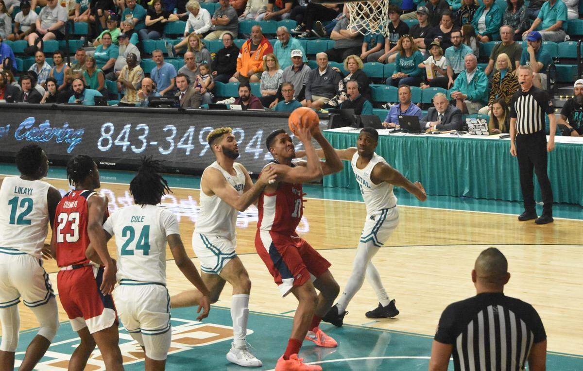 Fresno State forward Orlando Robinson goes up for a shot in the Bulldogs’ 86-74 victory over Coastal Carolina in the championship game of The Basketball Classic in Conway, S.C. Robinson had a double-double with 20 points and 14 rebounds as well as four assists, one steal and one blocked shot.