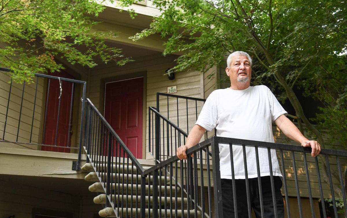 Eloy Cardenas stands near his apartment unit at the Sierra Ridge Apartments in Clovis on Monday, Aug. 16, 2021. Cardenas had been staying at his apartment for about 2 years but says he will need to find other housing after finding out that apartment complex will no longer honor the low-income program he was on.