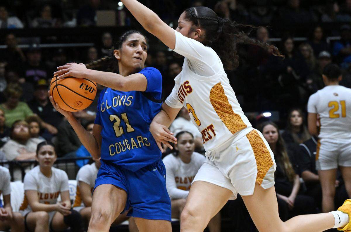 Clovis High’s Saiyu Sidhu, left, struggles against Clovis West’s Ramie Chatman, right, in the CIF Division I Girls Basketball Championship Saturday, March 1, 2025 in Fresno.