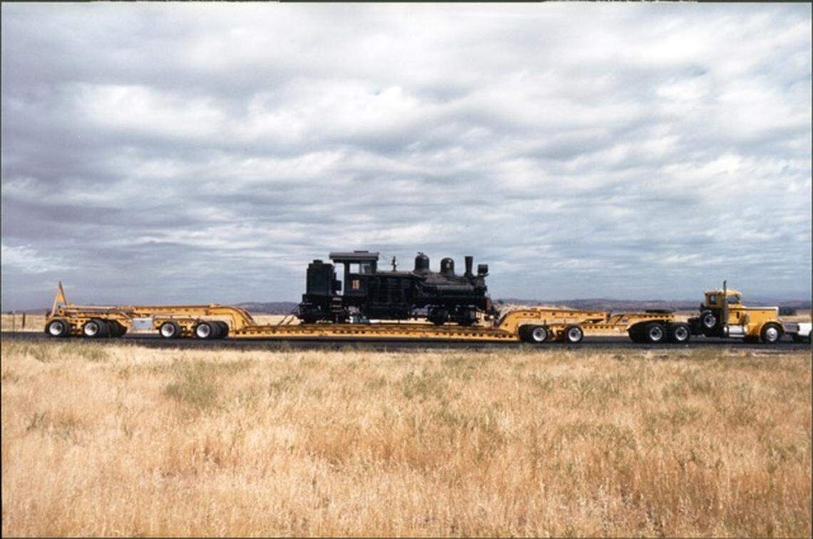 Yosemite Mountain Sugar Pine Railroad’s number 15 locomotive being transported to the railroad south of Yosemite National Park following its purchase in 1986. It was built in 1913 for the Sierra Nevada Wood and Lumber Company. The railroad’s number 10 locomotive, built in 1928, also remains in operation.
