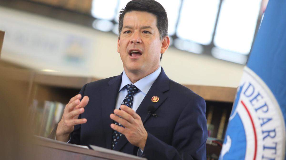 TJ Cox is shown giving a keynote speech in 2019 during his time in Congress. Cox was arrested by the FBI on August 16, 2022 and charged with multiple fraud allegations.