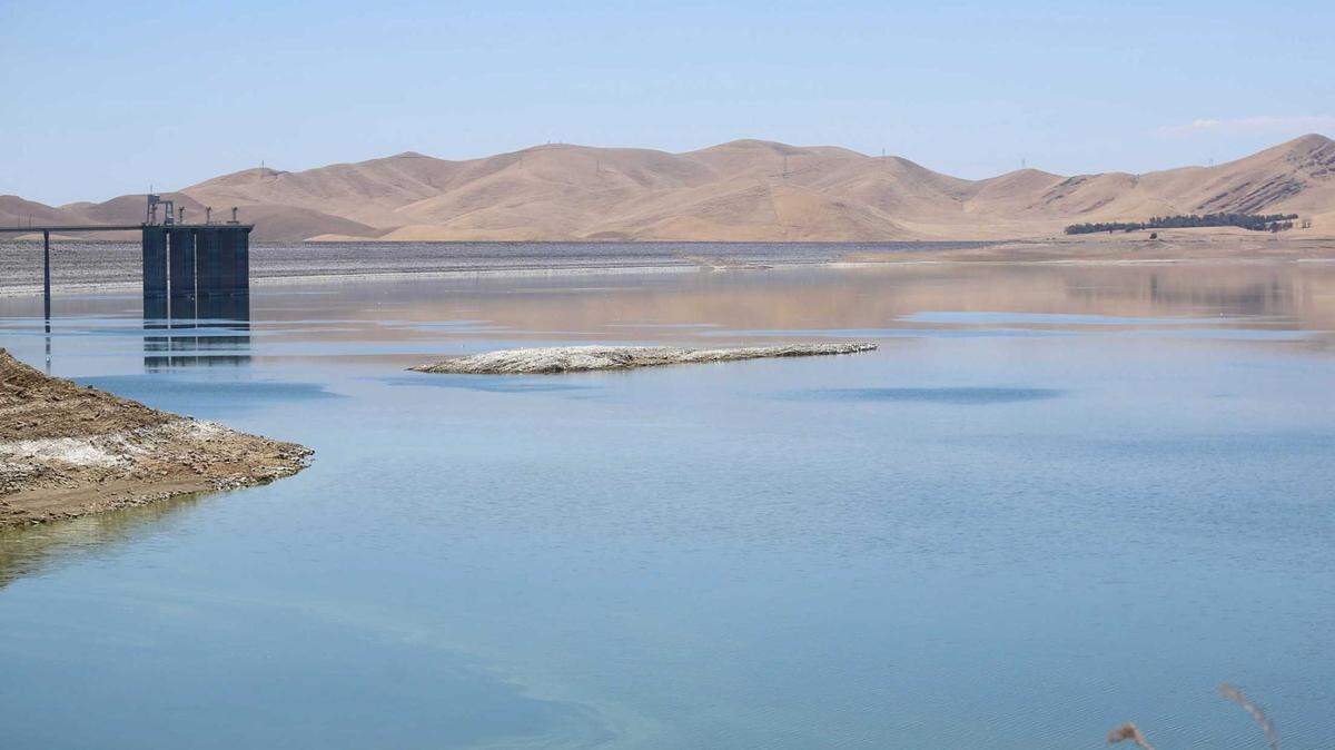 The water level is low in the San Luis Reservoir west of Los Banos in late June. The reservoir is a key part of the lake and canal systems that move water from Northern California to central and southern parts of the state.